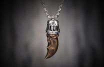 Bronze King's Claw pendant with a studded silver cap, featuring rectangular cutouts, suspended from a matching silver chain.