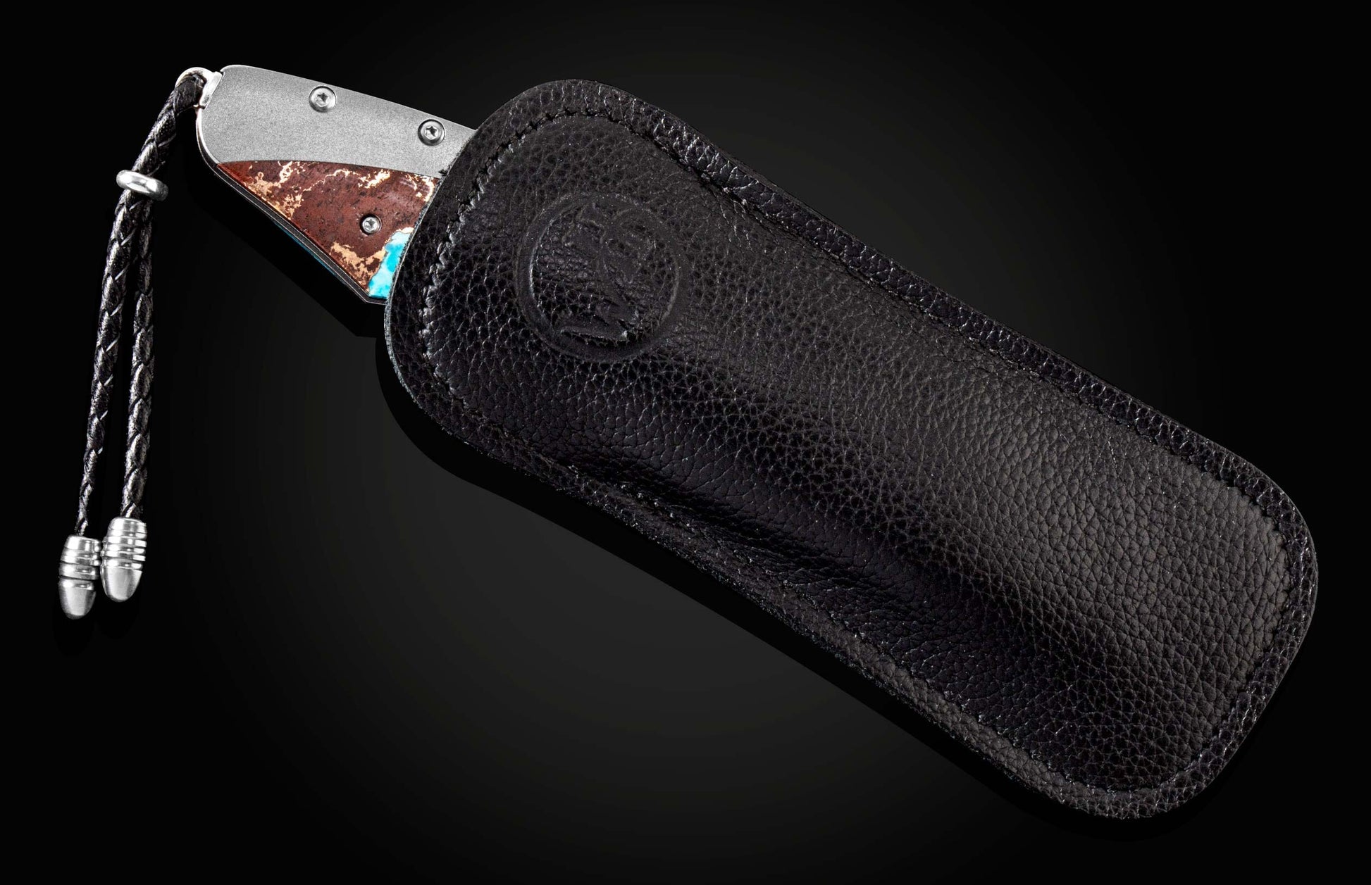 The Desert Blues Turquoise and Titanium Pocket Knife in a leather case