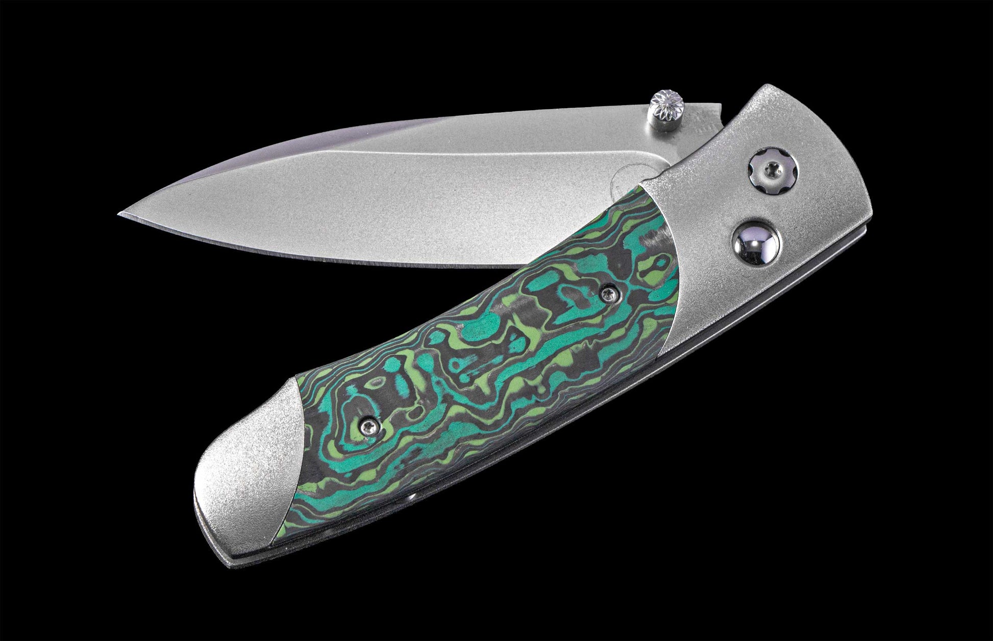 Foldable knife with a decorative handle on a black background