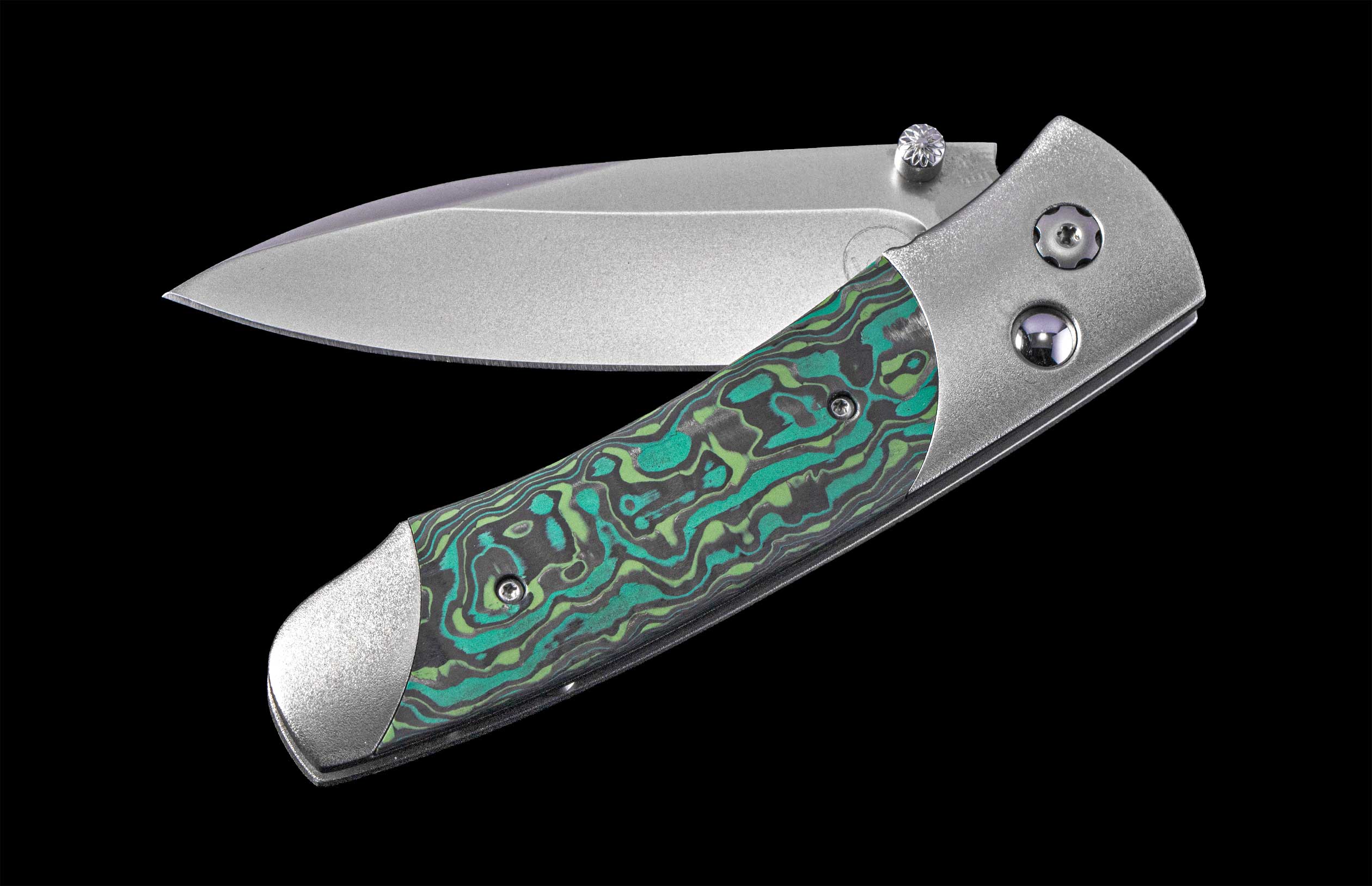 Foldable knife with a decorative handle on a black background