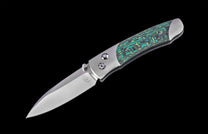 Folding knife with decorative handle on a black background