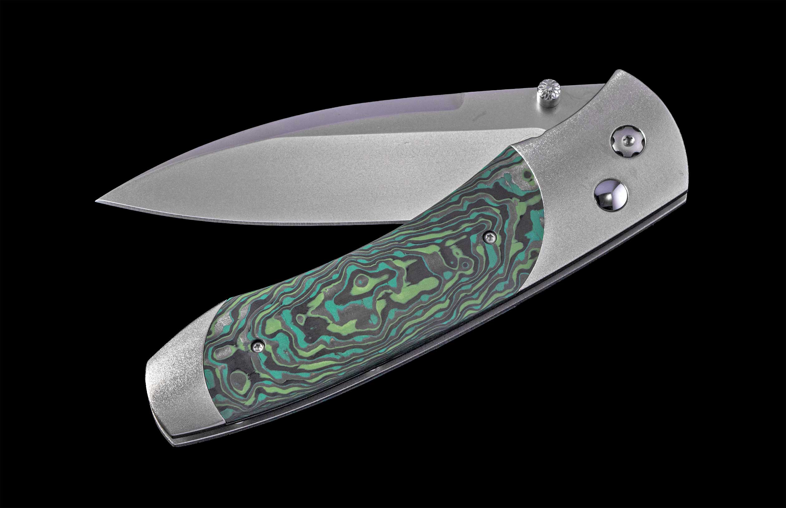 A folding knife with a matte silver blade and a green, teal, and gray swirled handle, partially open on black.