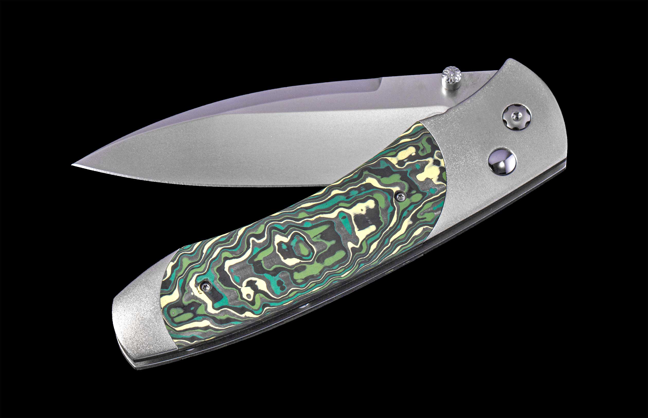 Folding knife with a decorative handle on a black background