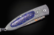 William Henry folding knife with damascus steel and blue lapis lazuli scales. 