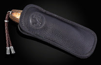 Folding knife with decorative handle in a black case