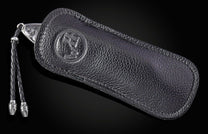 Hand engraved William Henry knife in black leather case