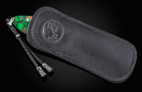 William Henry folding knife with Irish Green Stone in a black leather case