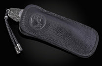 William Henry folding knife with Damascus steel blade  and frame with  Gibeon meteorite scales in a leather case