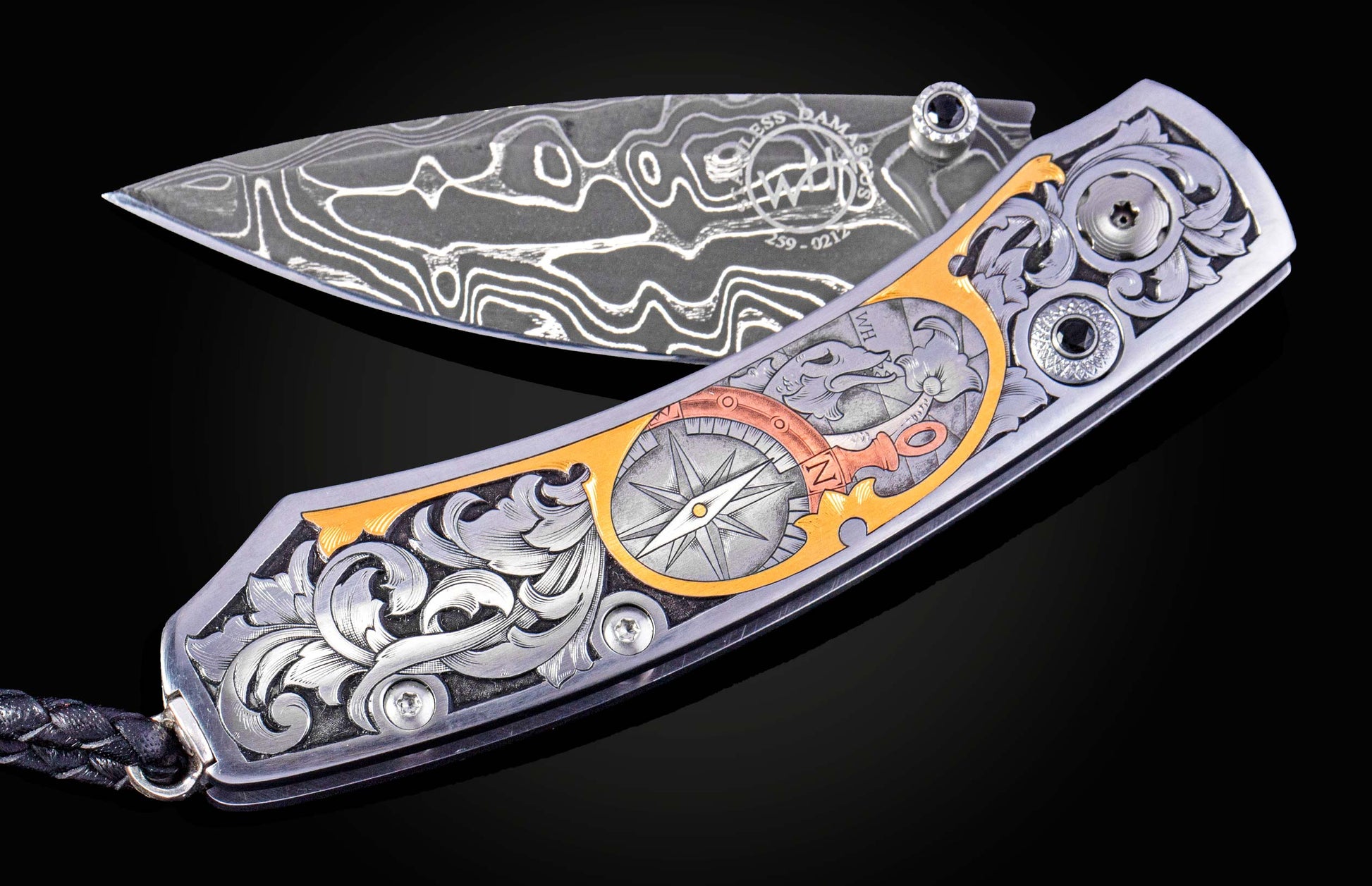 Hand engraved William Henry knife with damascus steel blade