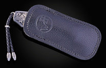 Hand engraved William Henry knife with damascus steel blade