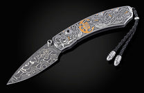 Decorative knife with intricate patterns on a dark background