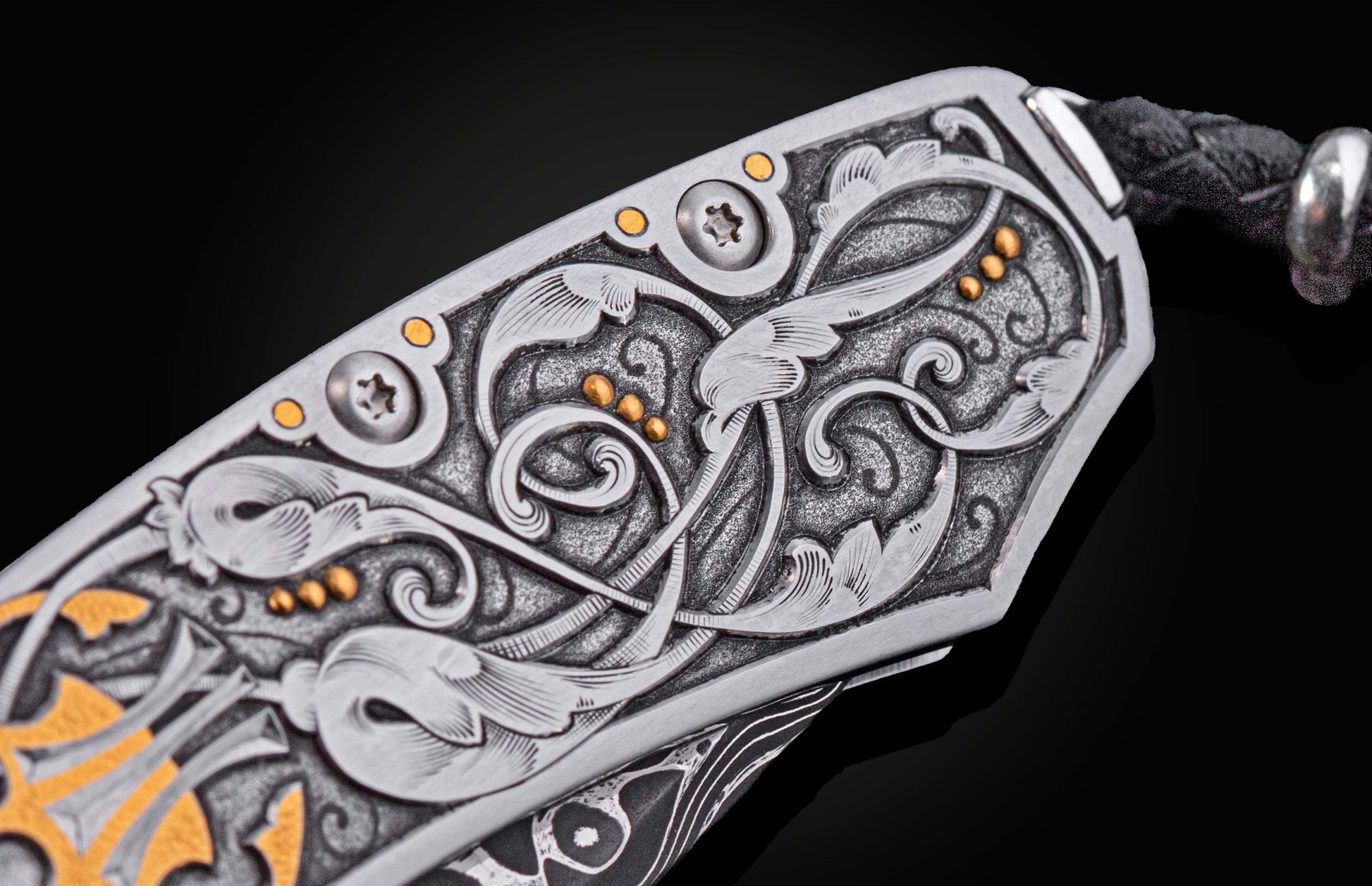 Decorative knife with intricate patterns on a dark background