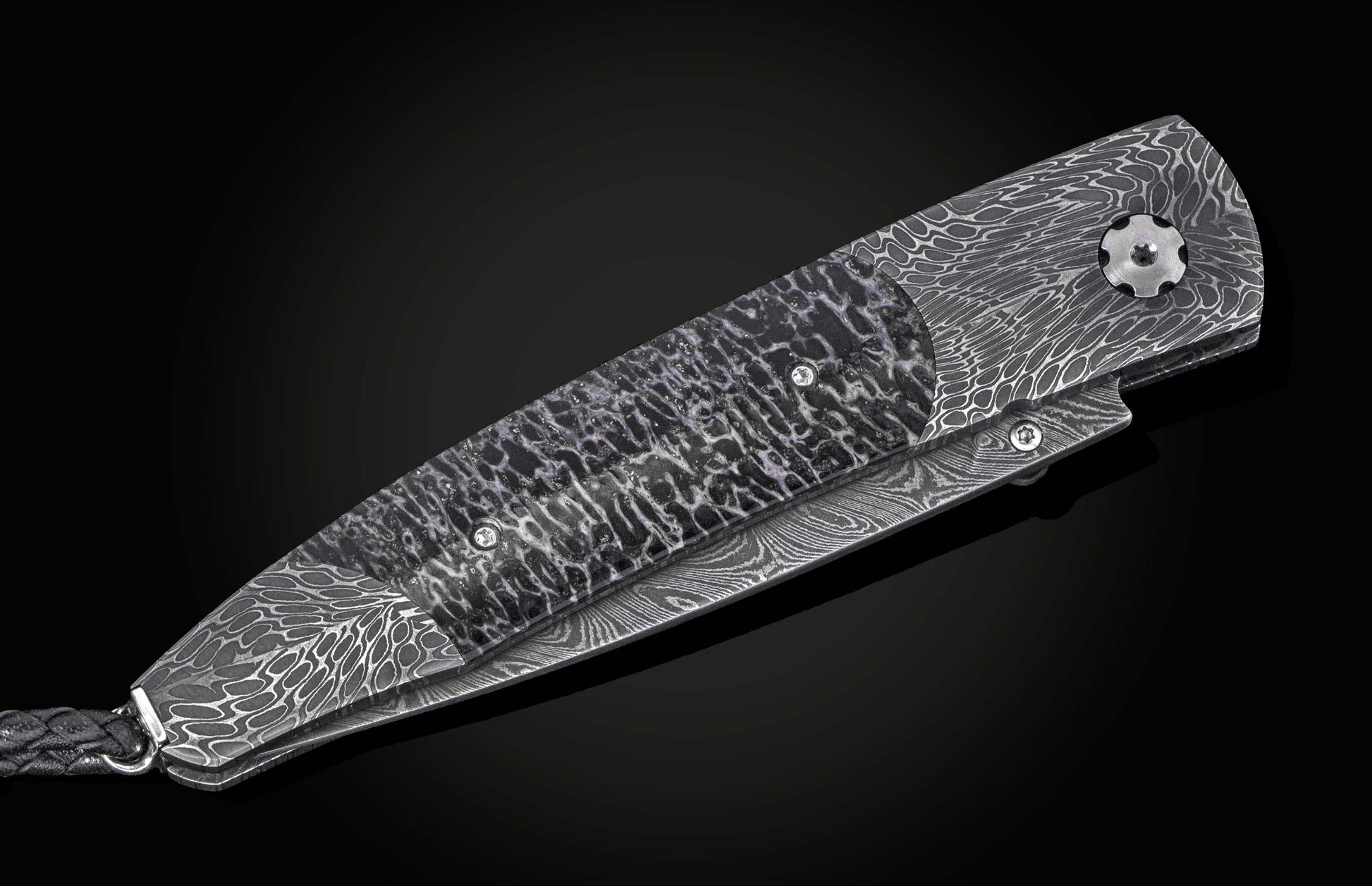 Damascus steel folding knife with wavy pattern and textured handle, side view on black background