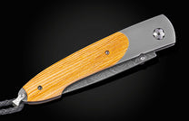 Damascus and titanium folding knife, inlaid with wood from the Gaylord Family Oklahoma Memorial Stadium bleachers