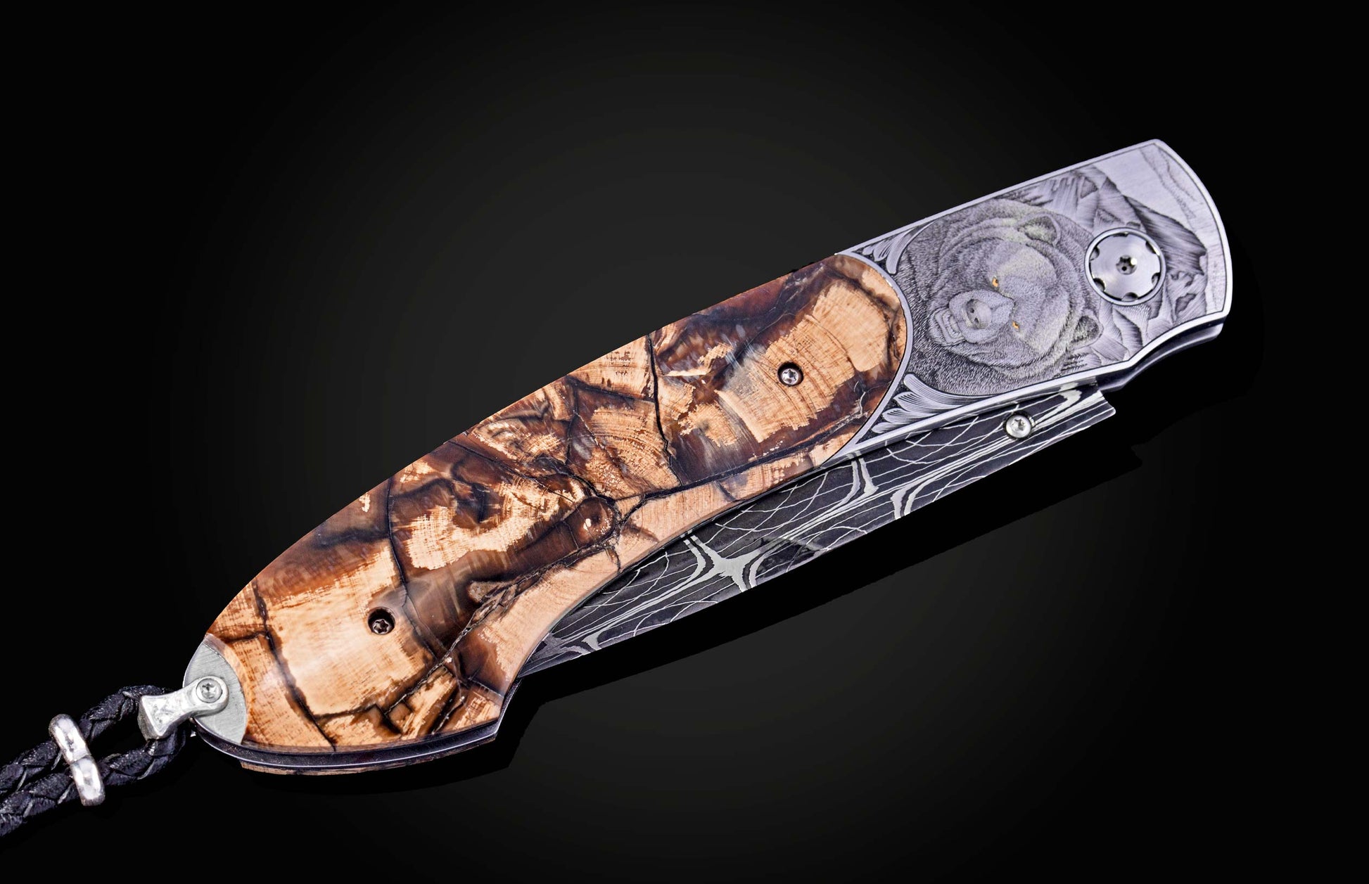 Hand engraved knife with Alaskan game animals, wooly mammoth tusk and damascus steel