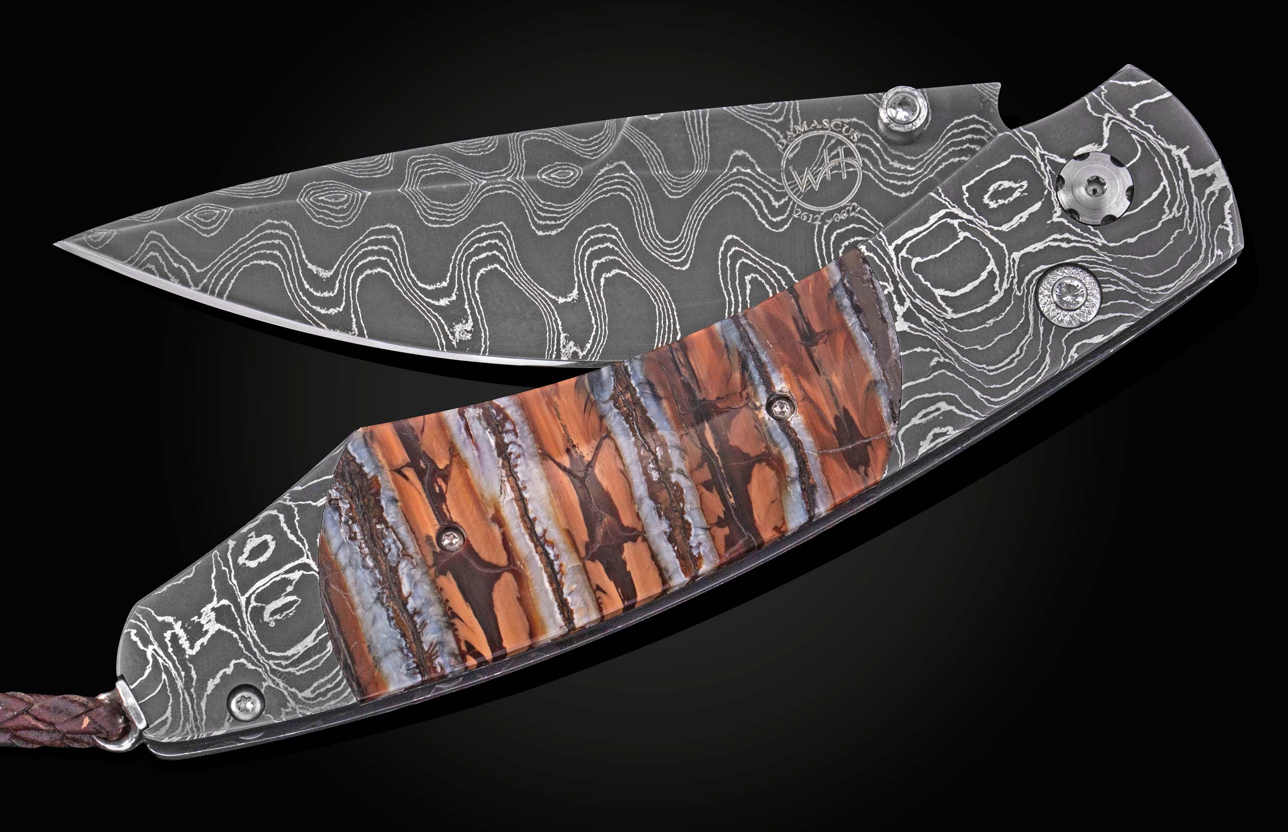 Folding knife with a wavy Damascus steel blade and frame, featuring a brown and blue striped handle inlay and a braided leather lanyard.