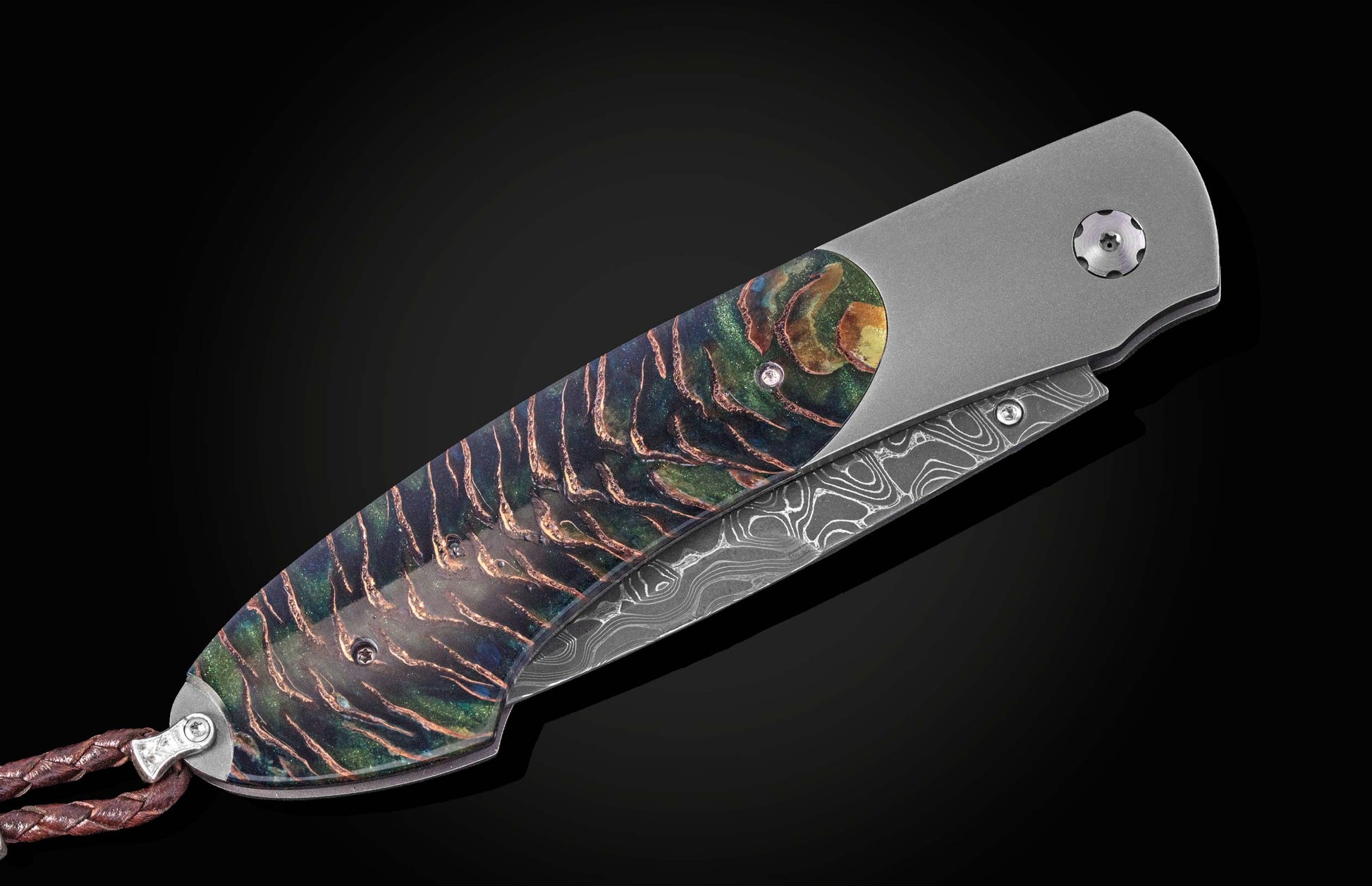 Luxury folding knife with iridescent Aurora Pine handle and damascus blade, side view on black background