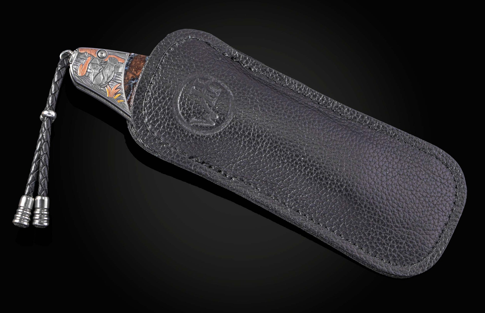 Decorative knife with intricate patterns on a dark background