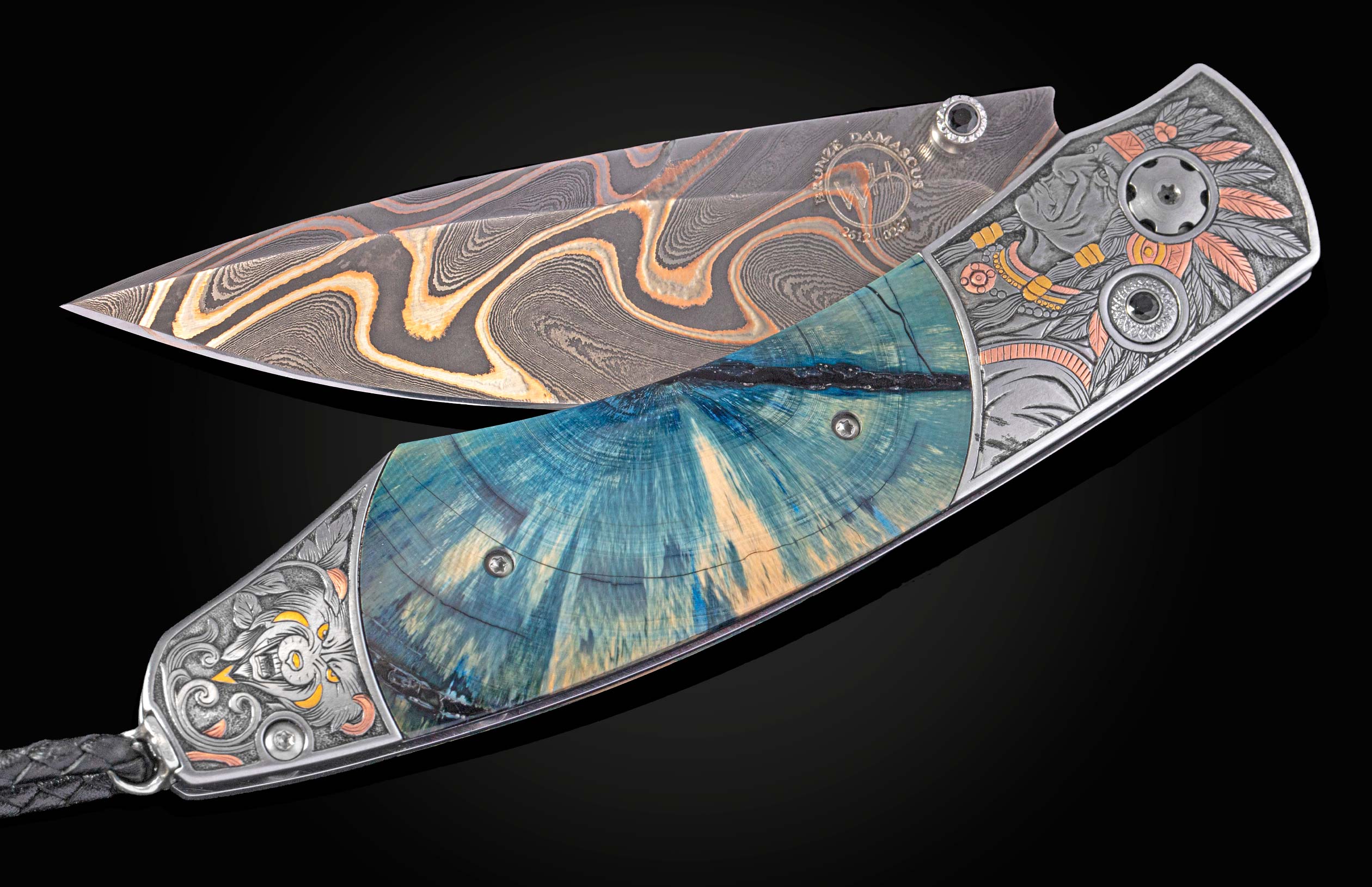 Open artisan folding knife with swirling Damascus blade, blue and teal wood handle, and engraved silver bolsters with colored accents.