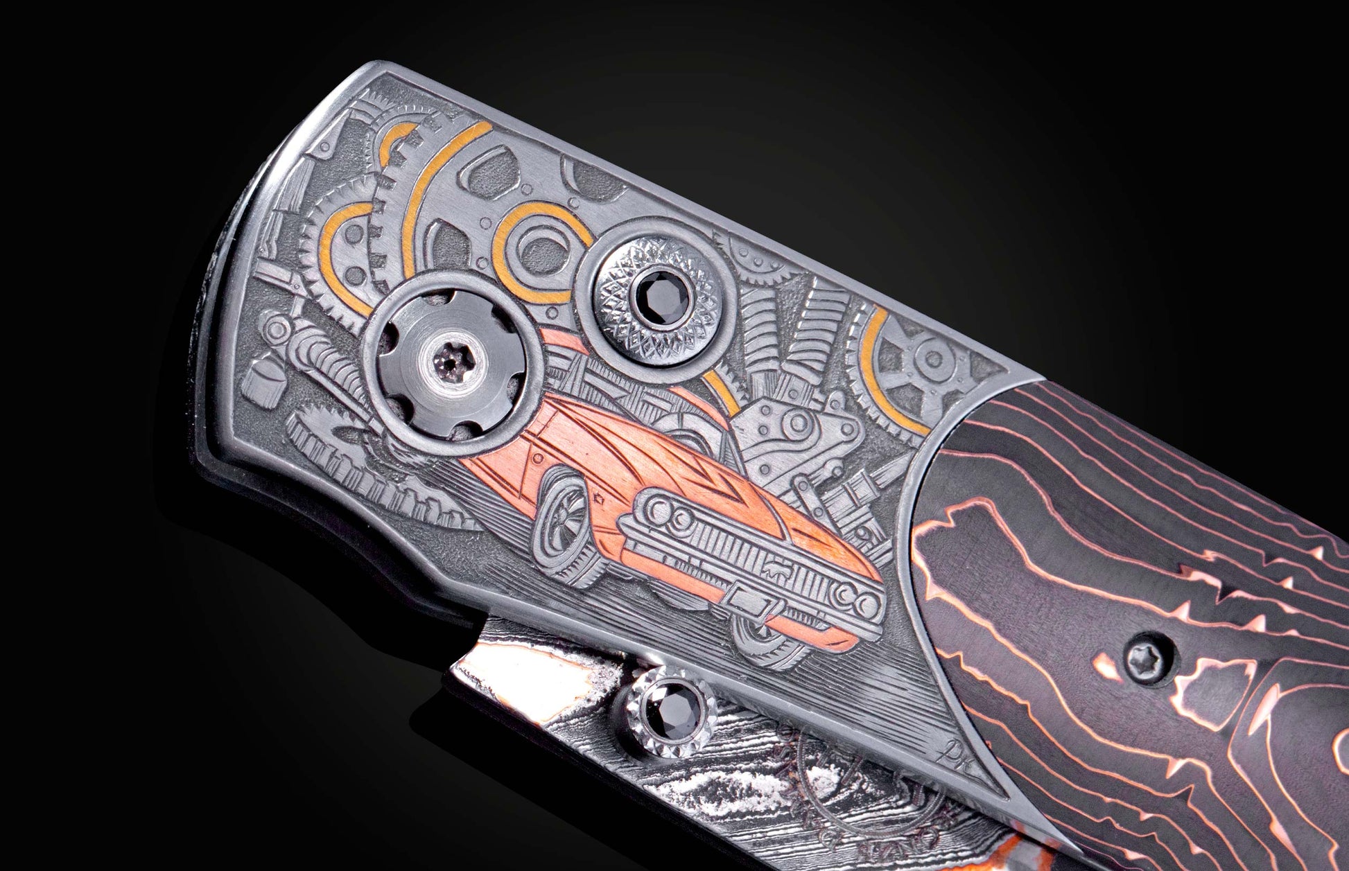Hand engraved knife with Damascus steel blade on a black background
