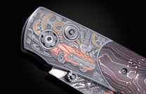 Hand engraved knife with Damascus steel blade on a black background