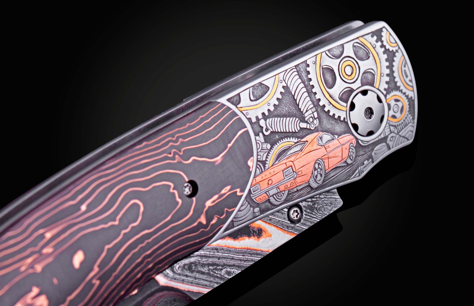 Hand engraved knife with Damascus steel blade on a black background