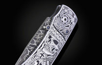 Decorative knife with intricate patterns on a dark background