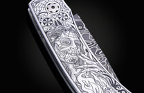 Decorative knife with intricate patterns on a dark background