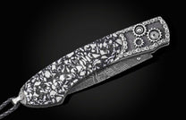 Luxury folding knife with black and white mosaic handle, gear accents, and textured blade by B12 Daytona Drift, side view on dark background