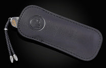 knife in black leather case
