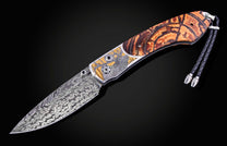 Hand engraved William Henry knife depicting an Elk with fossil woolly mammoth tusk and damascus steel