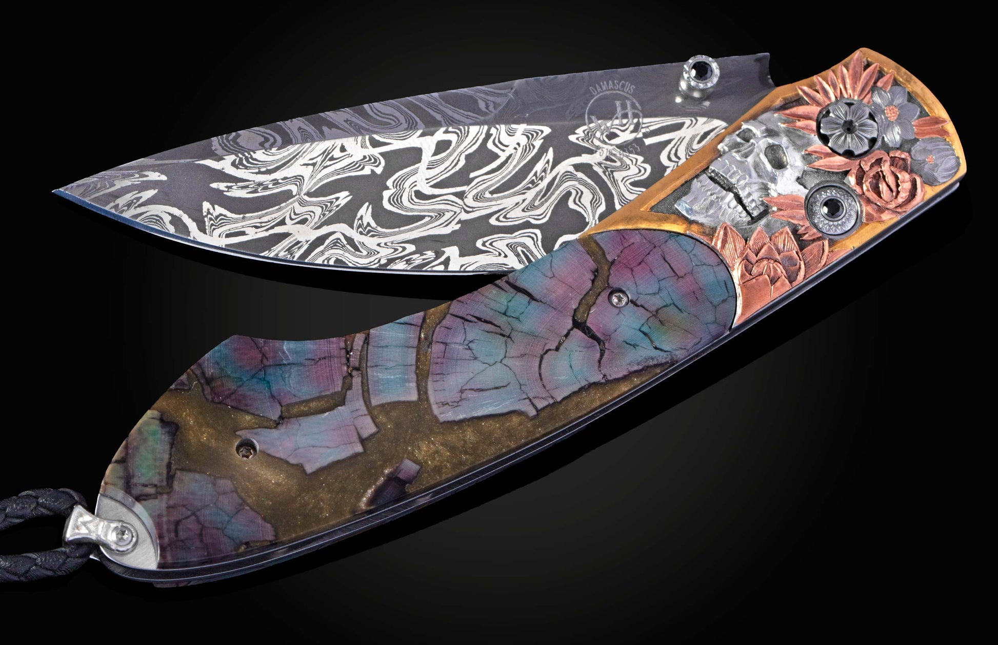Hand engraved knife with fossil mammoth tusk on a black background