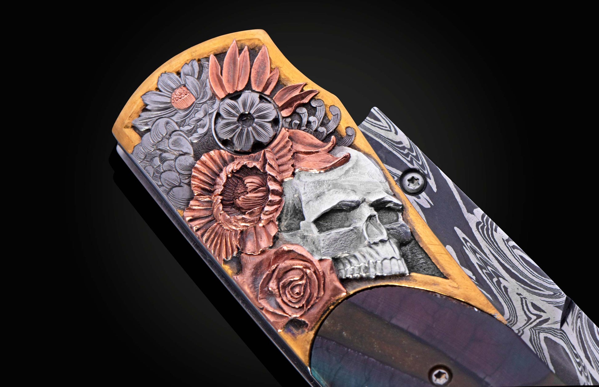 Hand engraved knife with fossil mammoth tusk on a black background