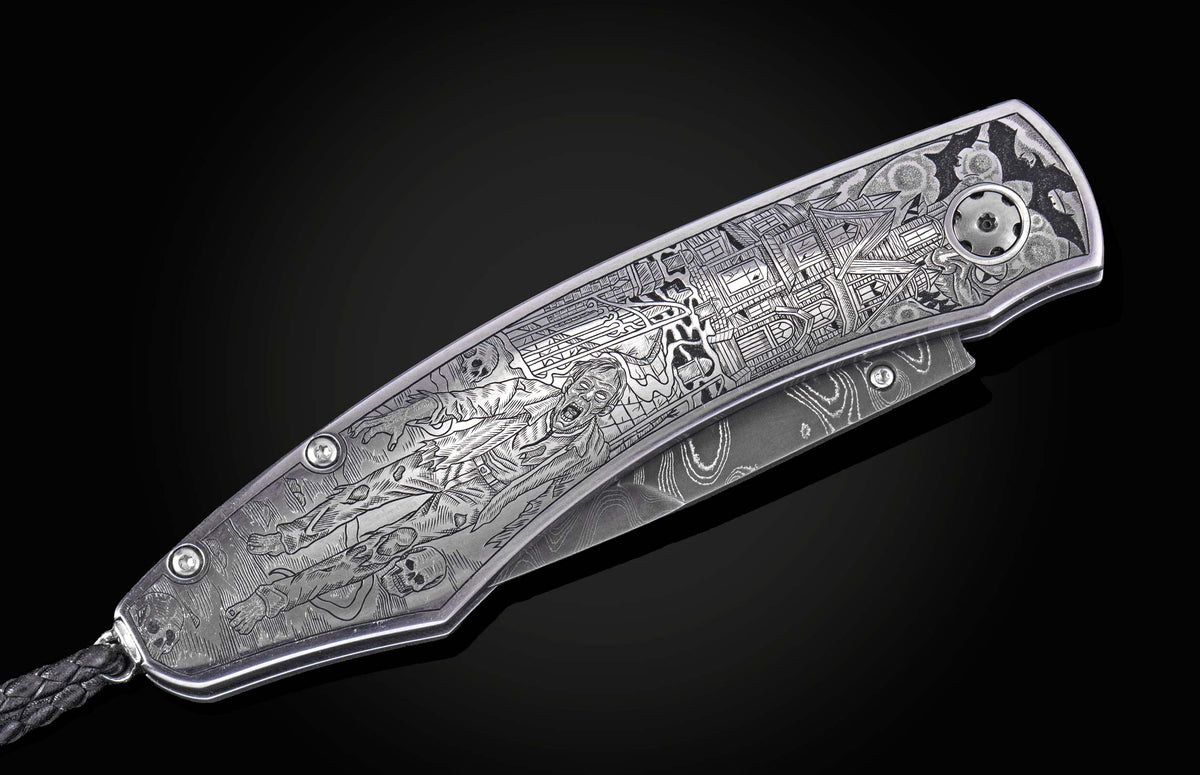 Luxury folding knife with intricate Halloween-themed engraving, featuring zombies and haunted scenes, by B12, silver-toned metal with damascus blade, side view on black background