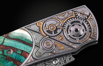 Steampunk-style folding knife with intricate gear design and green marbled handle, side view close-up