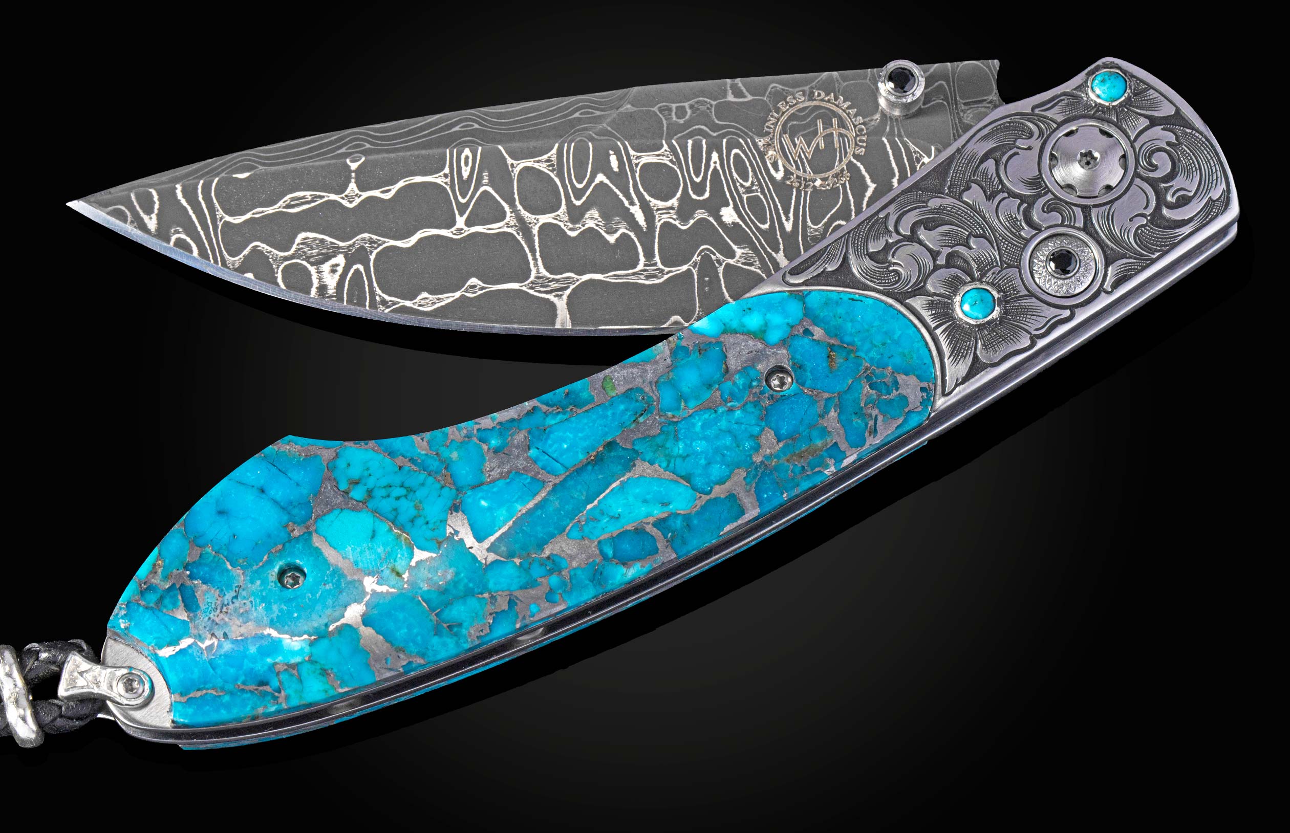 A folding knife with a stainless Damascus steel blade and a bright blue Kingman turquoise handle featuring silver engraving and gemstone inlays.