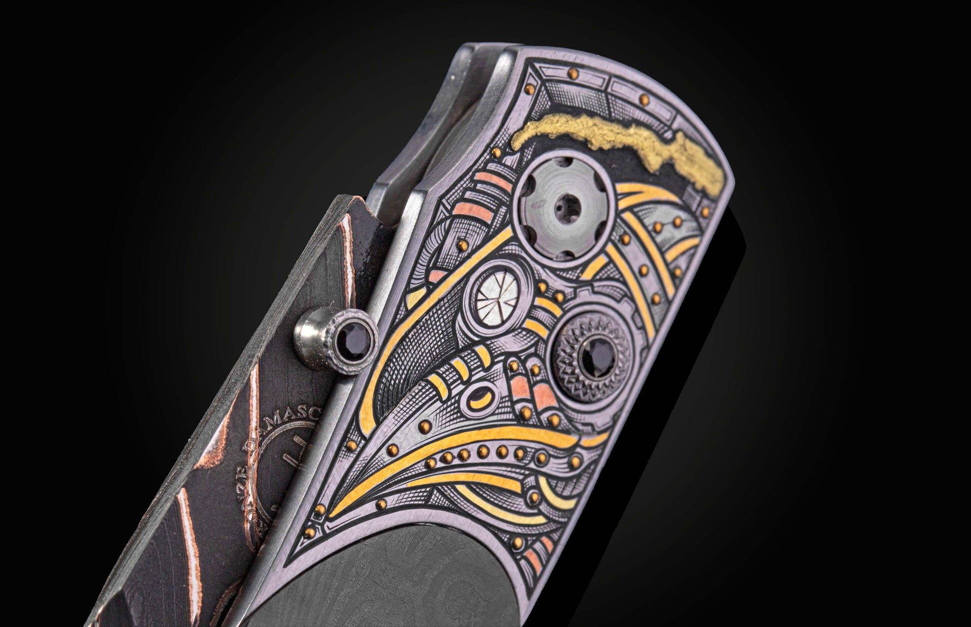 Knife with ornate silver, gold, and copper etched handle featuring gears and black gems, side view.