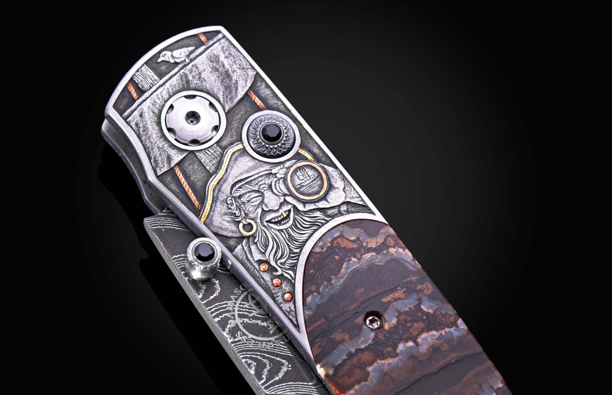 Detail view of hand engraved pirate on decorative knife