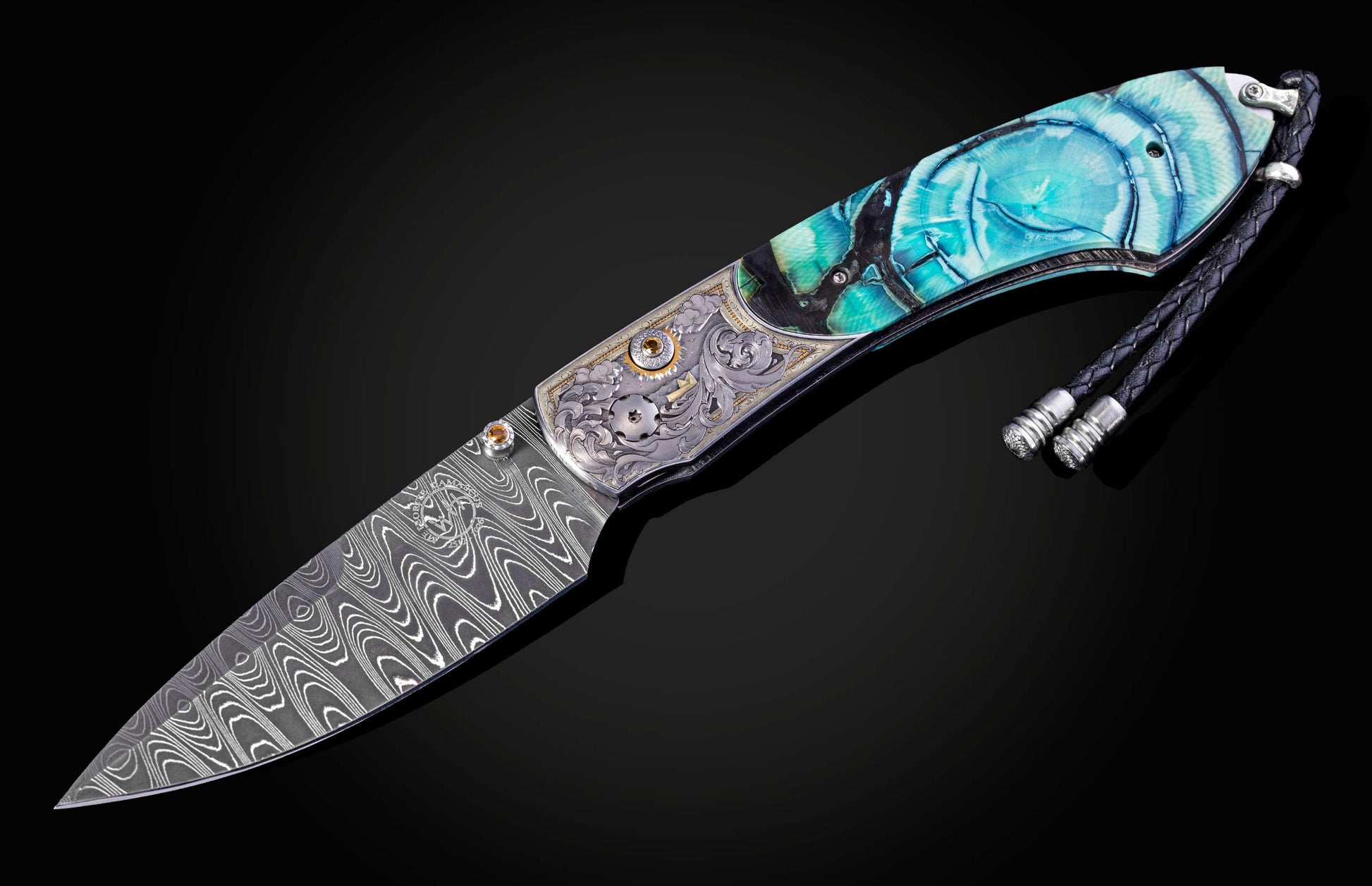 Damascus blade knife with decorative handle on a black background