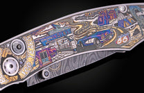 Decorative knife with an intricately engraved, multi-colored Route 66 scene on the handle and a swirling Damascus pattern on the blade.