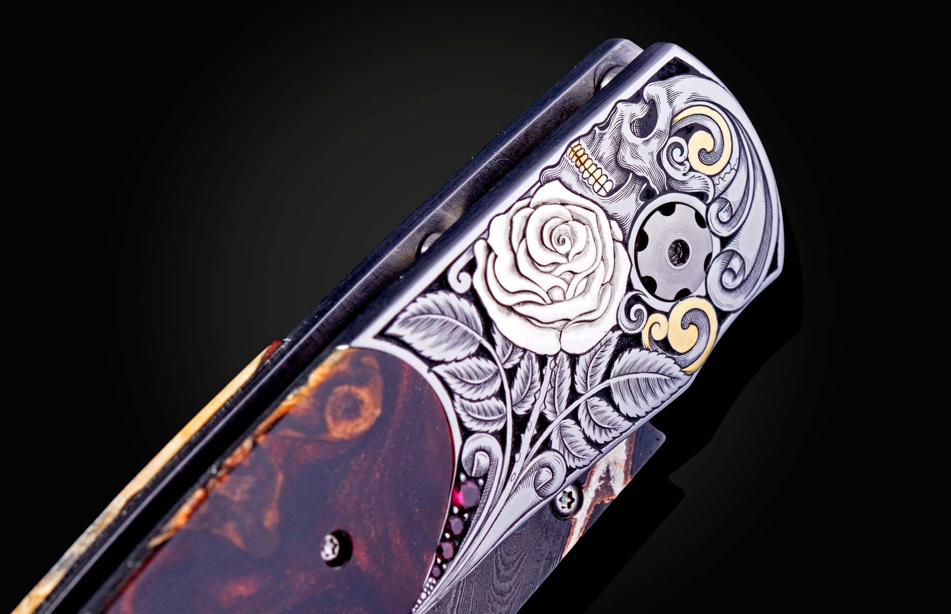 Decorative knife with artistic handle design on a black background