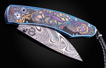 Color laser engraved William Henry Knife with damascus steel blade showing sea life