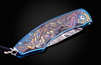 Color laser engraved William Henry Knife with damascus steel blade showing sea life