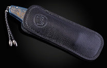 Color laser engraved William Henry Knife with damascus steel blade showing sea life