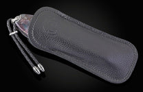 Black leather case with a strap on a black background