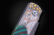 Decorative knife handle with an etched horse head, golden stars, copper bridle, and a green striped inlay.
