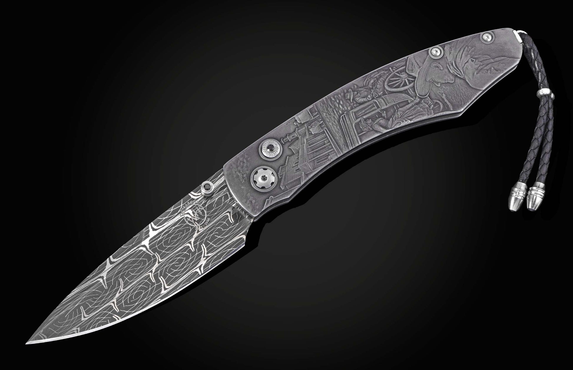 Ornate folding knife with a Damascus steel blade and engraved handle depicting a Western town scene, featuring a black leather lanyard.