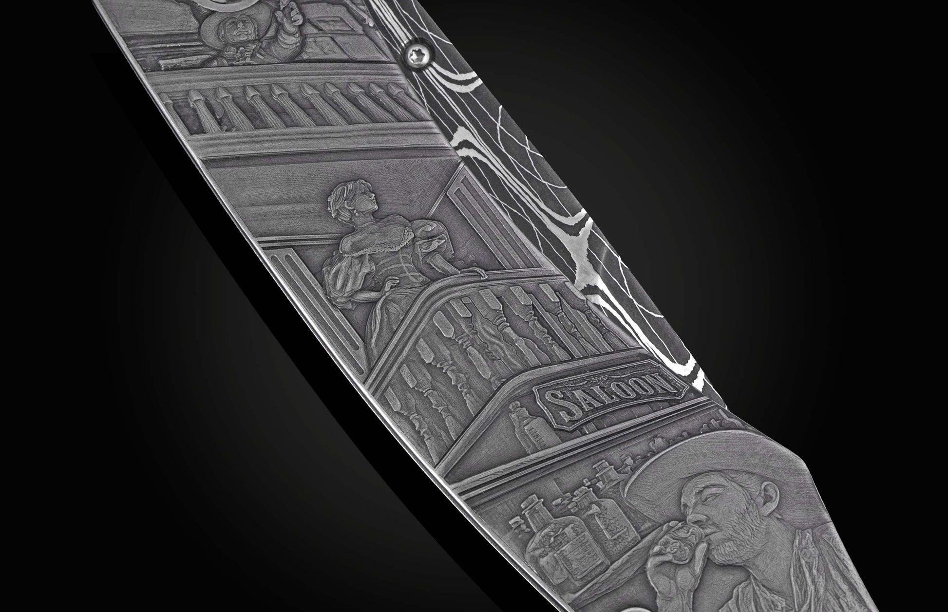 Engraved metal knife with a detailed Western saloon scene featuring a woman, a "Saloon" sign, and a man drinking.
