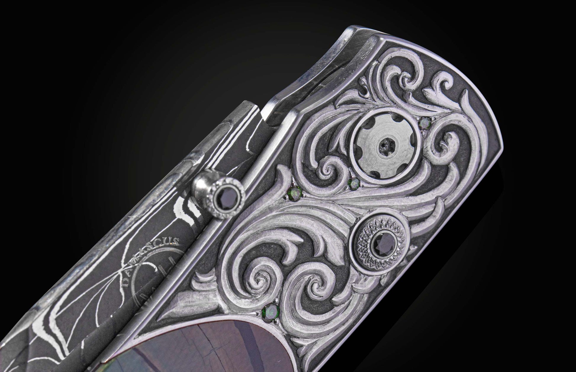 Decorative knife with damascus blade and fossilized woolly mammoth tusk scales on a black background
