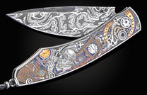 Decorative knife with intricate designs on a black background